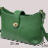 Green leather handbag with gold hardware; labeled dimensions show height 13.5 cm, width 23 cm, and depth 6.5 cm.