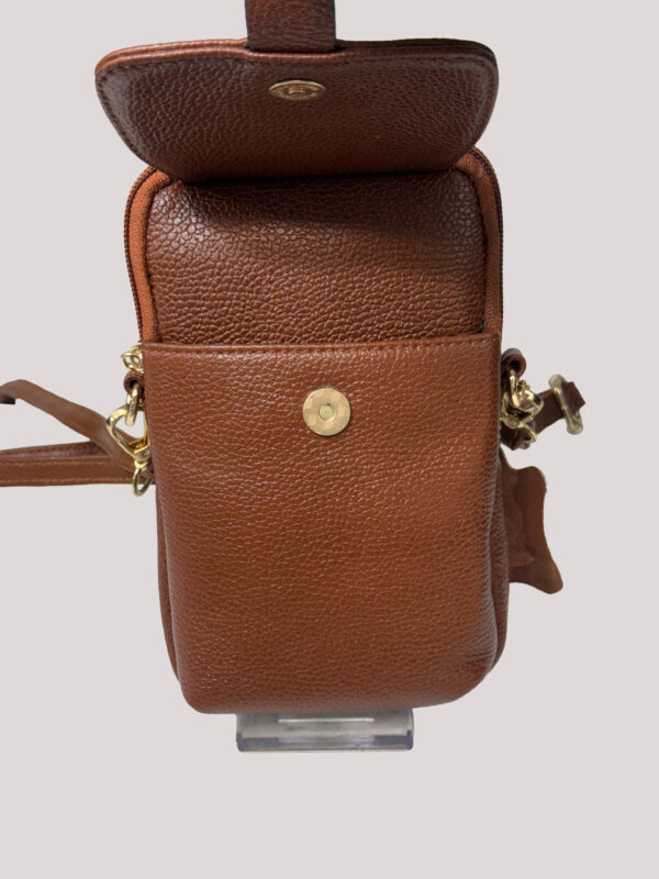 Brown pebbled leather mini bag with open front flap and gold snap, showing strap attachments and zipper detail on the side.